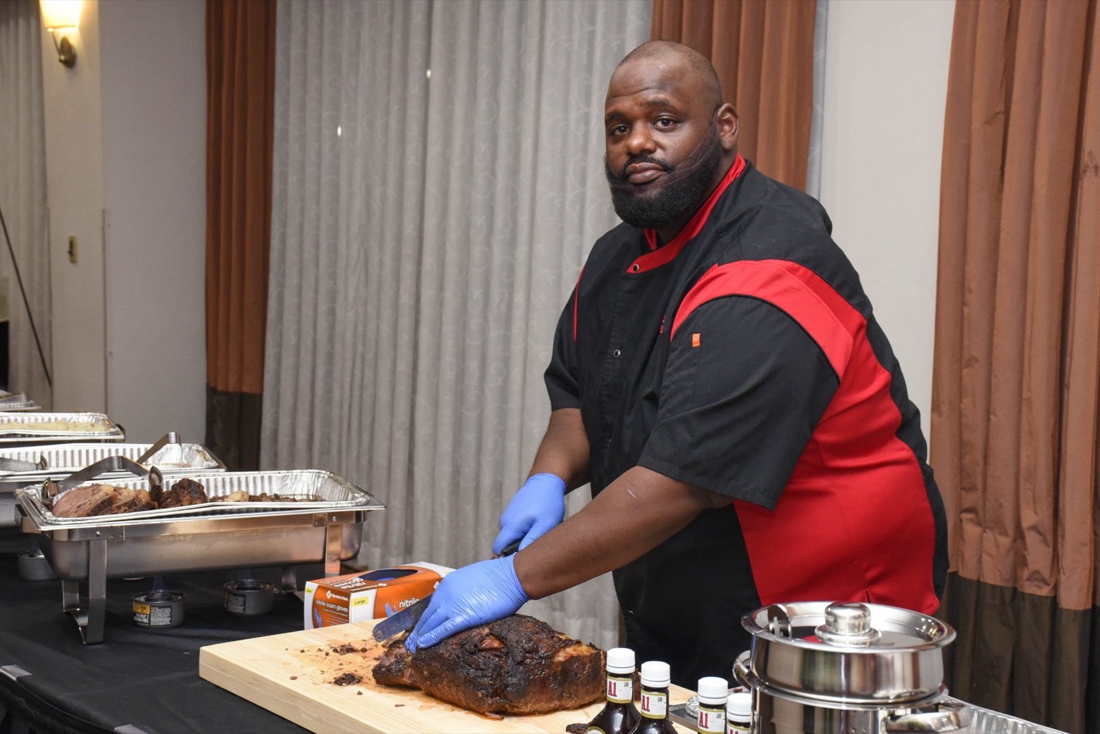 Chef Benny carving smoked brisket